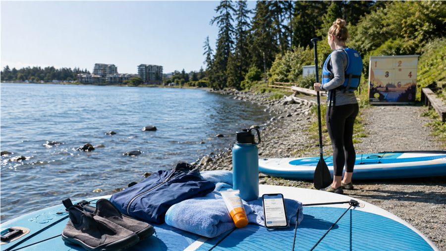 Personal items prepared on a paddleboard before a PaddlePoint ride