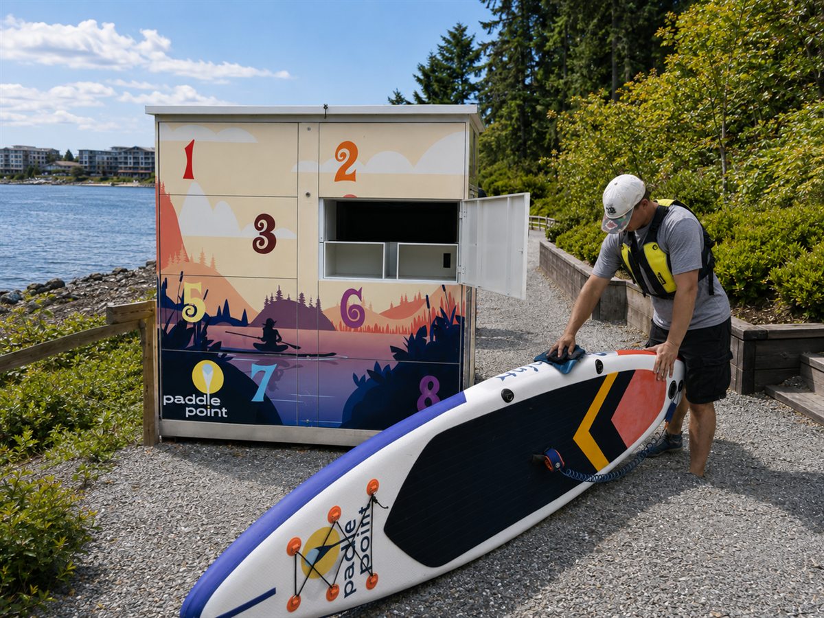 Paddler cleaning the paddleboard near the Parksville locker