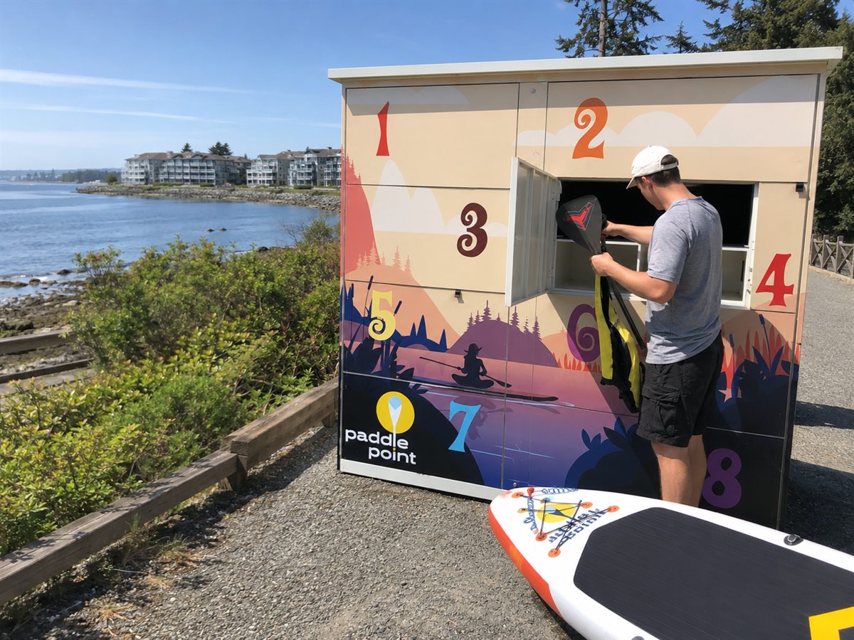 Paddler collecting paddle and life jacket from the Parksville locker